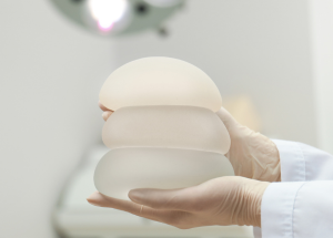 Assessment for breast implant replacement or removal