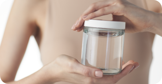 Motiva® Preservé™ 11 a person holding a jar of water