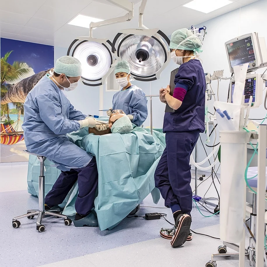 a group of people in a operating room