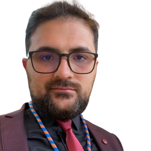 Dr. Arkaz Coskun in formal attire with tie.